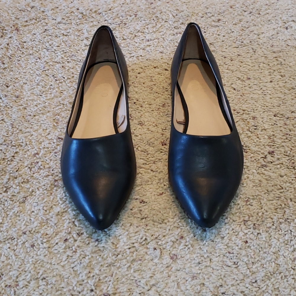 Black leather slip on pointed flats